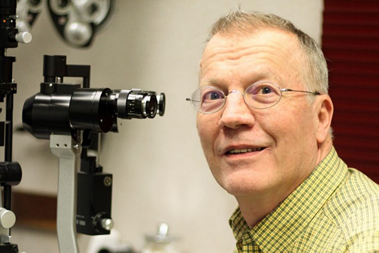 Dr. Hughes performing an eye examination