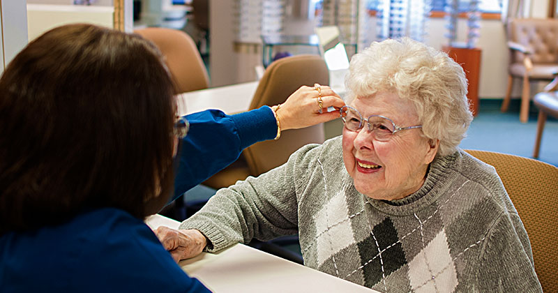 Mature women trying on a pair of eyeglasses