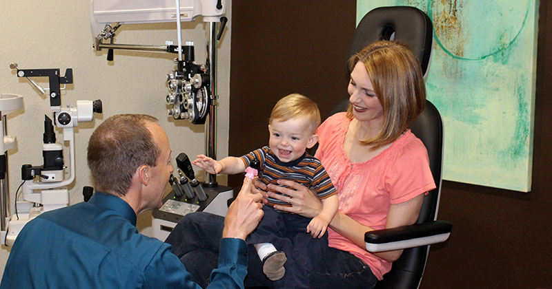 Doctor with a pediatric child eye exam